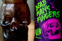 A bottle of Dead Man's Fingers CBD-infused Hemp Rum with a rum cocktail