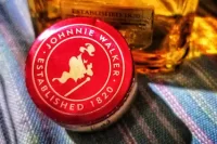 The cap from a bottle of Johnnie Walker Scottish whisky